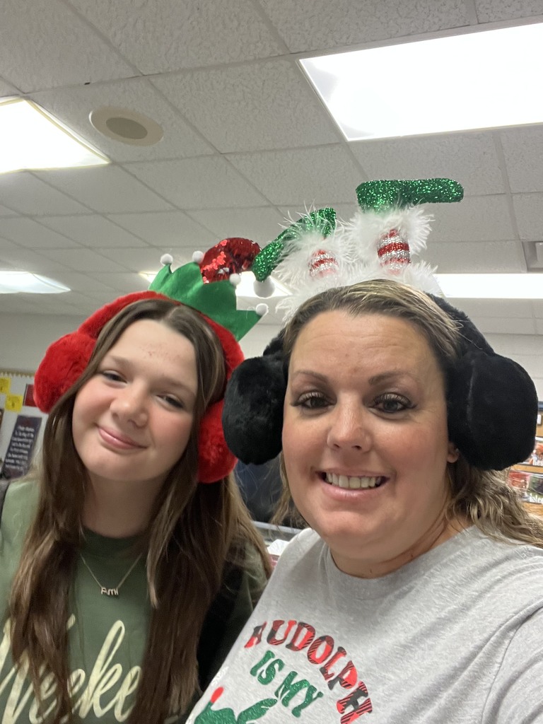 Ms. Brown and Alie with their Christmas hats